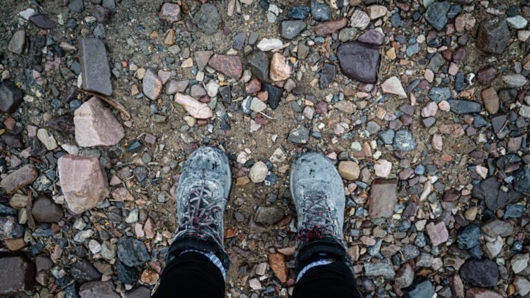 a person standing on top of a rocky ground