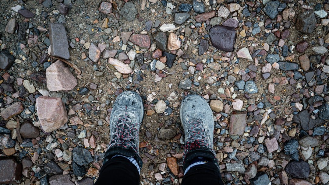 a person standing on top of a rocky ground